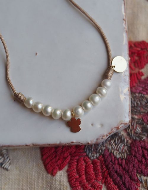 bracelet perles et ange en or 18 carats